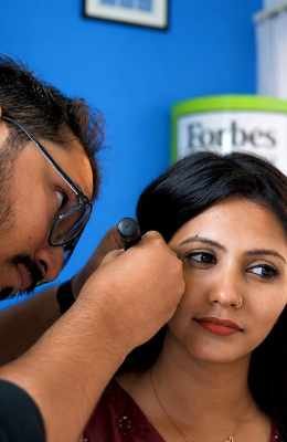 Audiologist providing hearing aid aftercare support