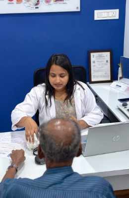 Family discussing hearing aid pricing with clinic staff