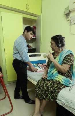 Audiologist conducting a hearing test